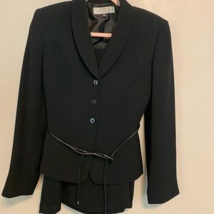 Black skirt suit with stylish belt